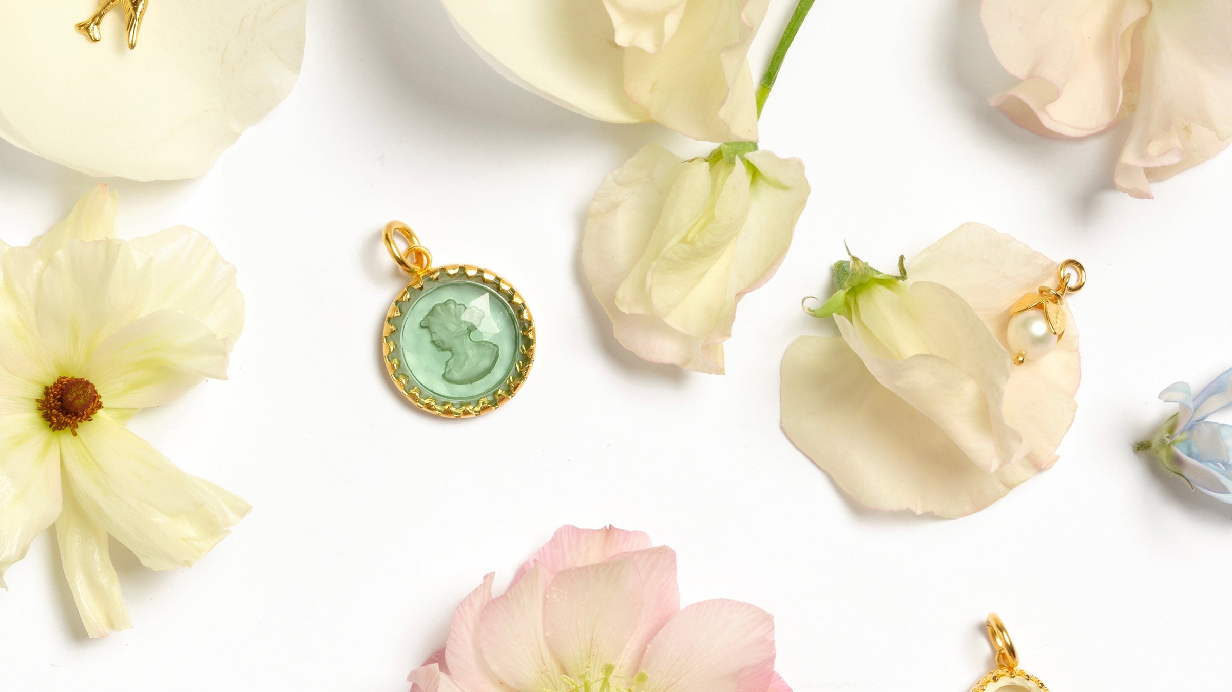 charms sitting on a bed of flowers