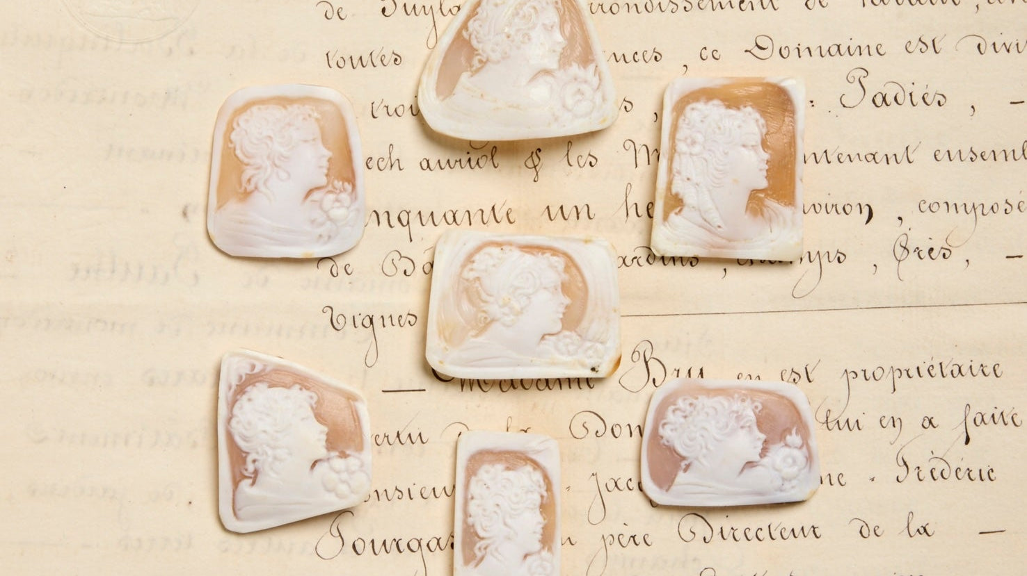 Carved shell cameos ontop of antique french correspondence