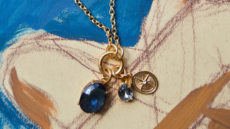 a necklace on a painted watercolor background