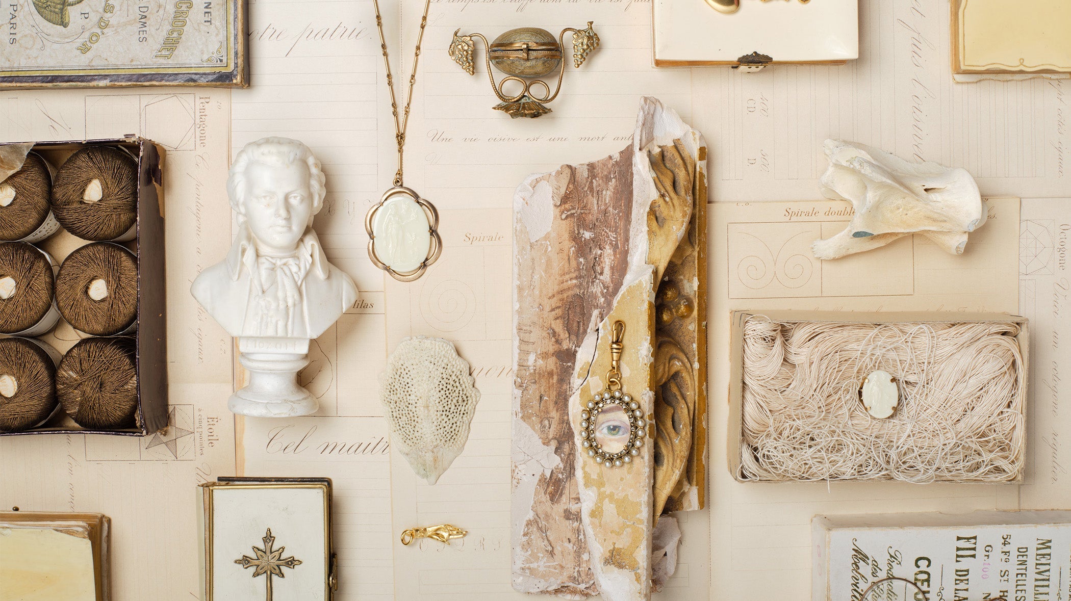 Ivory Flatlay of fallen aristocrat jewlery mixed with antiques