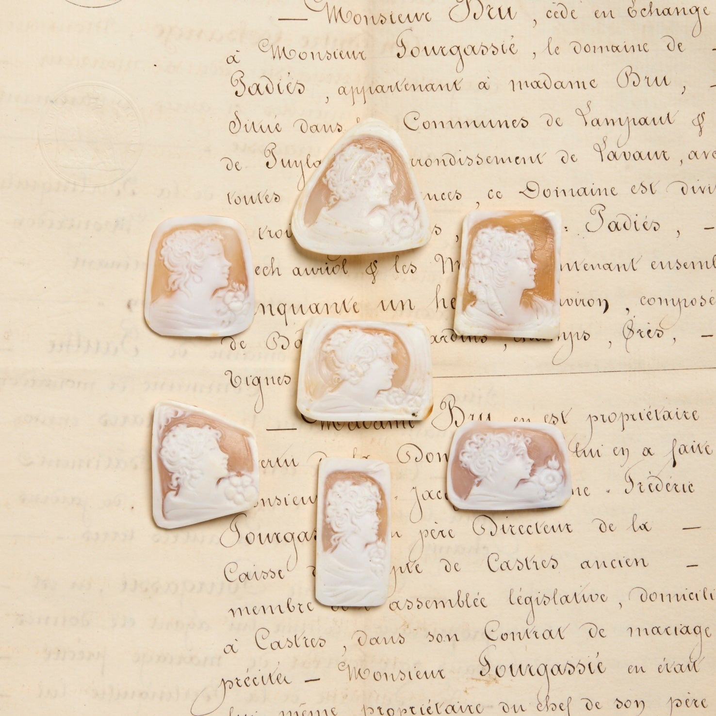Carved shell cameos ontop of antique french correspondence