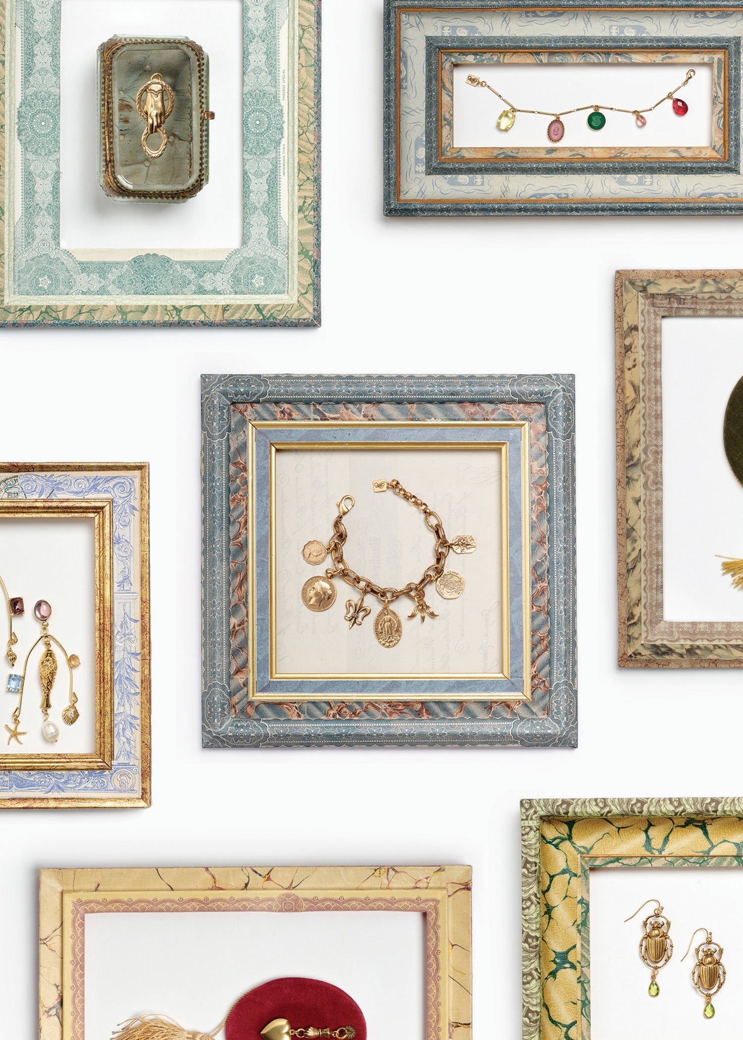 Gold jewlery in handmade frames 
